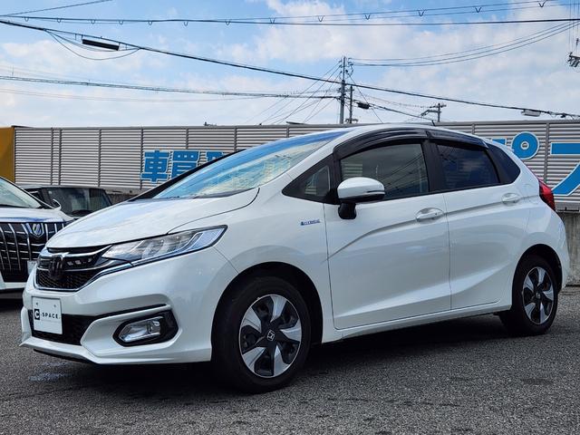 フィットハイブリッド Ｌ　ホンダセンシング　１オーナー・禁煙車／純正ナビＴＶ／Ｂｌｕｅｔｏｏｔｈ／Ｂカメラ／ＥＴＣ／コンビシート／タイヤ４本新品交換渡し／スマートキー＆Ｐスタート／車両取説・ナビ取説・スペアキー有（3枚目）
