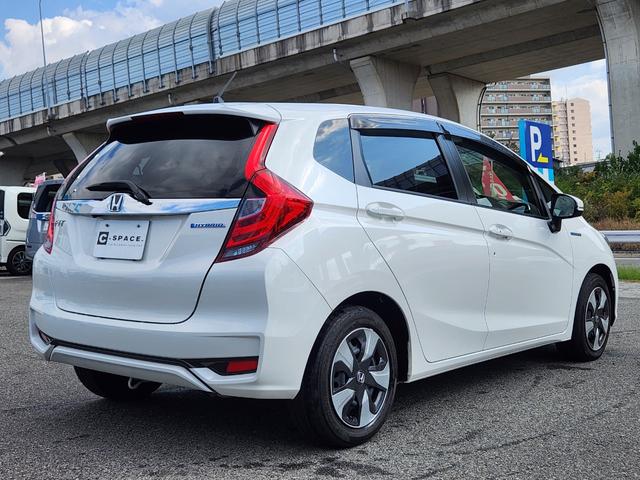 フィットハイブリッド Ｌ　ホンダセンシング　１オーナー・禁煙車／純正ナビＴＶ／Ｂｌｕｅｔｏｏｔｈ／Ｂカメラ／ＥＴＣ／コンビシート／タイヤ４本新品交換渡し／スマートキー＆Ｐスタート／車両取説・ナビ取説・スペアキー有（9枚目）