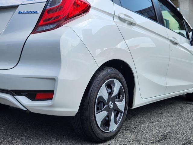 フィットハイブリッド Ｌ　ホンダセンシング　１オーナー・禁煙車／純正ナビＴＶ／Ｂｌｕｅｔｏｏｔｈ／Ｂカメラ／ＥＴＣ／コンビシート／タイヤ４本新品交換渡し／スマートキー＆Ｐスタート／車両取説・ナビ取説・スペアキー有（10枚目）