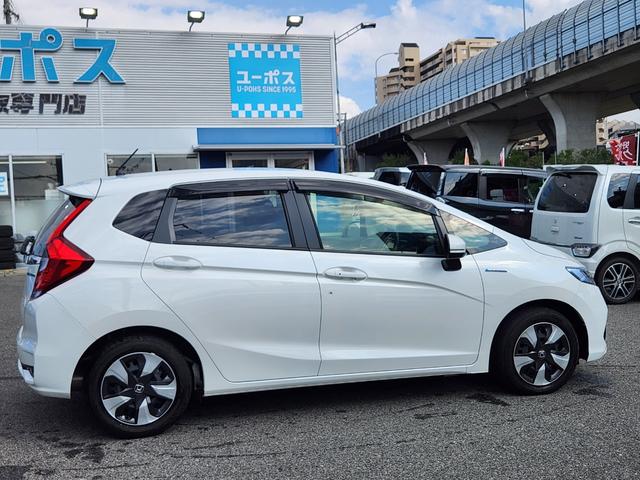 フィットハイブリッド Ｌ　ホンダセンシング　１オーナー・禁煙車／純正ナビＴＶ／Ｂｌｕｅｔｏｏｔｈ／Ｂカメラ／ＥＴＣ／コンビシート／タイヤ４本新品交換渡し／スマートキー＆Ｐスタート／車両取説・ナビ取説・スペアキー有（11枚目）