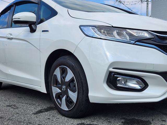 フィットハイブリッド Ｌ　ホンダセンシング　１オーナー・禁煙車／純正ナビＴＶ／Ｂｌｕｅｔｏｏｔｈ／Ｂカメラ／ＥＴＣ／コンビシート／タイヤ４本新品交換渡し／スマートキー＆Ｐスタート／車両取説・ナビ取説・スペアキー有（12枚目）