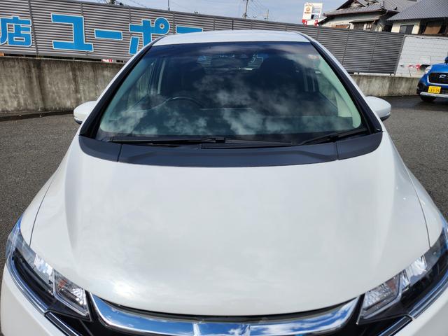 フィットハイブリッド Ｌ　ホンダセンシング　１オーナー・禁煙車／純正ナビＴＶ／Ｂｌｕｅｔｏｏｔｈ／Ｂカメラ／ＥＴＣ／コンビシート／タイヤ４本新品交換渡し／スマートキー＆Ｐスタート／車両取説・ナビ取説・スペアキー有（16枚目）