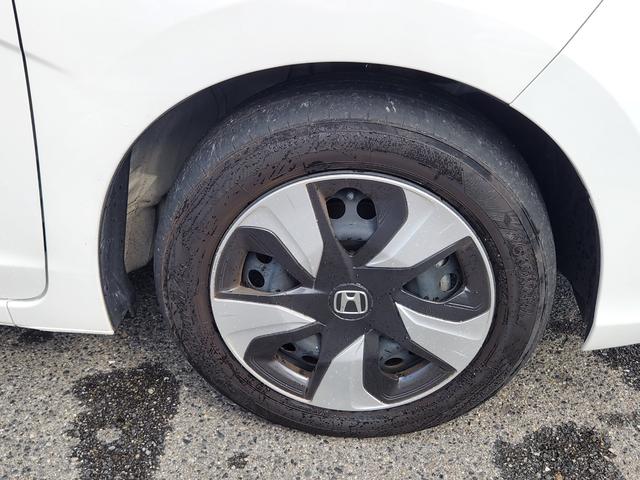 フィットハイブリッド Ｌ　ホンダセンシング　１オーナー・禁煙車／純正ナビＴＶ／Ｂｌｕｅｔｏｏｔｈ／Ｂカメラ／ＥＴＣ／コンビシート／タイヤ４本新品交換渡し／スマートキー＆Ｐスタート／車両取説・ナビ取説・スペアキー有（18枚目）