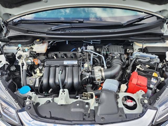 フィットハイブリッド Ｌ　ホンダセンシング　１オーナー・禁煙車／純正ナビＴＶ／Ｂｌｕｅｔｏｏｔｈ／Ｂカメラ／ＥＴＣ／コンビシート／タイヤ４本新品交換渡し／スマートキー＆Ｐスタート／車両取説・ナビ取説・スペアキー有（22枚目）