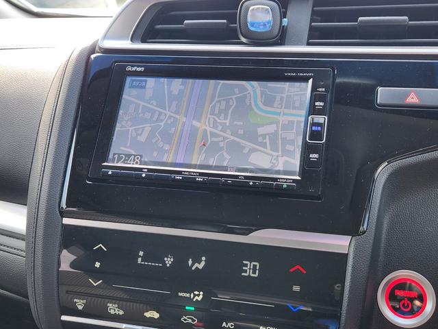 フィットハイブリッド Ｌ　ホンダセンシング　１オーナー・禁煙車／純正ナビＴＶ／Ｂｌｕｅｔｏｏｔｈ／Ｂカメラ／ＥＴＣ／コンビシート／タイヤ４本新品交換渡し／スマートキー＆Ｐスタート／車両取説・ナビ取説・スペアキー有（27枚目）