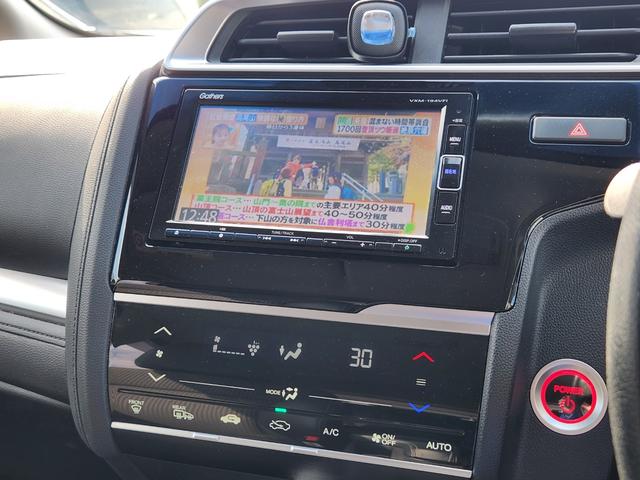 フィットハイブリッド Ｌ　ホンダセンシング　１オーナー・禁煙車／純正ナビＴＶ／Ｂｌｕｅｔｏｏｔｈ／Ｂカメラ／ＥＴＣ／コンビシート／タイヤ４本新品交換渡し／スマートキー＆Ｐスタート／車両取説・ナビ取説・スペアキー有（28枚目）