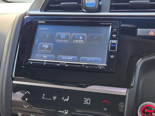 フィットハイブリッド Ｌ　ホンダセンシング　１オーナー・禁煙車／純正ナビＴＶ／Ｂｌｕｅｔｏｏｔｈ／Ｂカメラ／ＥＴＣ／コンビシート／タイヤ４本新品交換渡し／スマートキー＆Ｐスタート／車両取説・ナビ取説・スペアキー有（29枚目）