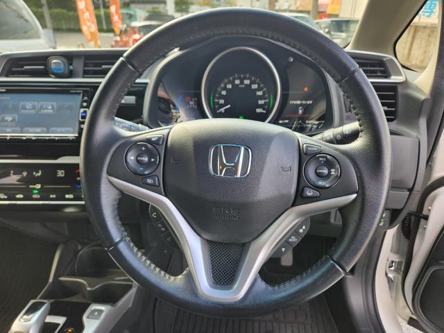 フィットハイブリッド Ｌ　ホンダセンシング　１オーナー・禁煙車／純正ナビＴＶ／Ｂｌｕｅｔｏｏｔｈ／Ｂカメラ／ＥＴＣ／コンビシート／タイヤ４本新品交換渡し／スマートキー＆Ｐスタート／車両取説・ナビ取説・スペアキー有（34枚目）