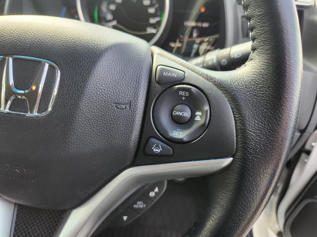 フィットハイブリッド Ｌ　ホンダセンシング　１オーナー・禁煙車／純正ナビＴＶ／Ｂｌｕｅｔｏｏｔｈ／Ｂカメラ／ＥＴＣ／コンビシート／タイヤ４本新品交換渡し／スマートキー＆Ｐスタート／車両取説・ナビ取説・スペアキー有（36枚目）