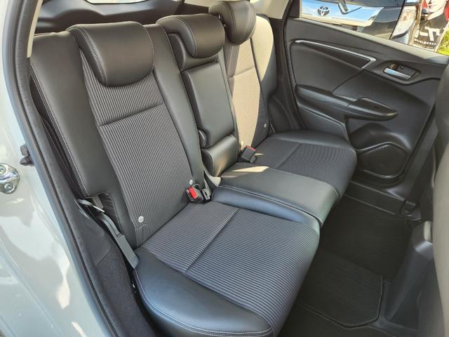 フィットハイブリッド Ｌ　ホンダセンシング　１オーナー・禁煙車／純正ナビＴＶ／Ｂｌｕｅｔｏｏｔｈ／Ｂカメラ／ＥＴＣ／コンビシート／タイヤ４本新品交換渡し／スマートキー＆Ｐスタート／車両取説・ナビ取説・スペアキー有（48枚目）