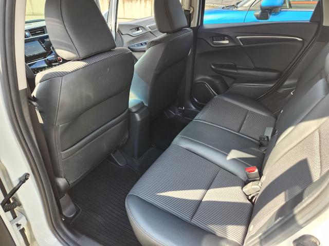 フィットハイブリッド Ｌ　ホンダセンシング　１オーナー・禁煙車／純正ナビＴＶ／Ｂｌｕｅｔｏｏｔｈ／Ｂカメラ／ＥＴＣ／コンビシート／タイヤ４本新品交換渡し／スマートキー＆Ｐスタート／車両取説・ナビ取説・スペアキー有（50枚目）