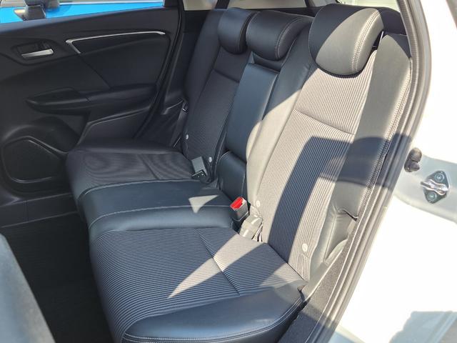 フィットハイブリッド Ｌ　ホンダセンシング　１オーナー・禁煙車／純正ナビＴＶ／Ｂｌｕｅｔｏｏｔｈ／Ｂカメラ／ＥＴＣ／コンビシート／タイヤ４本新品交換渡し／スマートキー＆Ｐスタート／車両取説・ナビ取説・スペアキー有（51枚目）