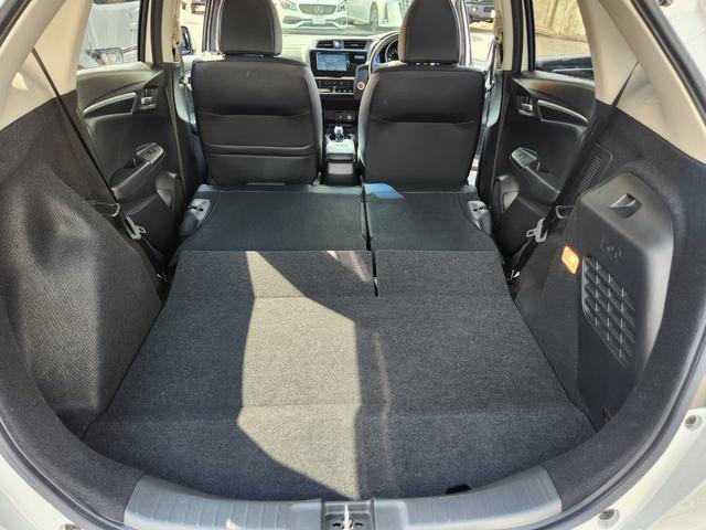 フィットハイブリッド Ｌ　ホンダセンシング　１オーナー・禁煙車／純正ナビＴＶ／Ｂｌｕｅｔｏｏｔｈ／Ｂカメラ／ＥＴＣ／コンビシート／タイヤ４本新品交換渡し／スマートキー＆Ｐスタート／車両取説・ナビ取説・スペアキー有（53枚目）