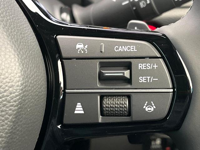 ステップワゴン ｅ：ＨＥＶスパーダ　登録済未使用車　純正１１型ナビ　両側電動ドア　パワーバックドア　ホンダセンシング　レーダークルーズコントロール　前席シートヒーター　ハーフレザーシート　ＬＥＤヘッドライト　前席シートバックテーブル（6枚目）