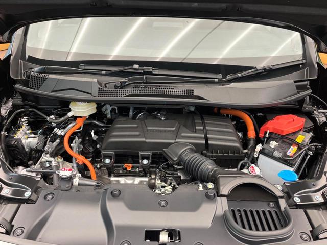 ステップワゴン ｅ：ＨＥＶスパーダ　登録済未使用車　純正１１型ナビ　両側電動ドア　パワーバックドア　ホンダセンシング　レーダークルーズコントロール　前席シートヒーター　ハーフレザーシート　ＬＥＤヘッドライト　前席シートバックテーブル（23枚目）