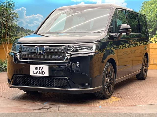 ステップワゴン ｅ：ＨＥＶスパーダ　登録済未使用車　純正１１型ナビ　両側電動ドア　パワーバックドア　ホンダセンシング　レーダークルーズコントロール　前席シートヒーター　ハーフレザーシート　ＬＥＤヘッドライト　前席シートバックテーブル（31枚目）
