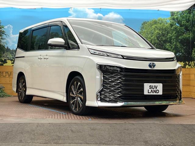 ヴォクシー ハイブリッドＳ－Ｚ　トヨタチームメイト　快適利便パッケージ　ＢＳＭ　純正１０．５型ナビ　ドライビングサポートパッケージ　１３型有機ＥＬフリップダウン　１００Ｖ電源　コーナーセンサー　プロジェクター式ＬＥＤヘッド（16枚目）