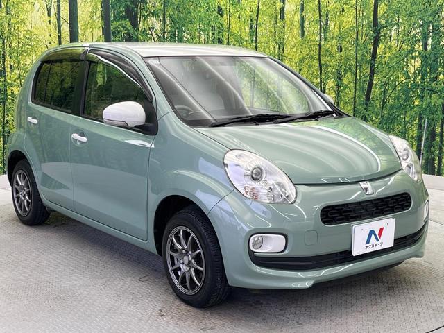 パッソ プラスハナ　ビルトインＥＴＣ　１４インチアルミホイール　オートエアコン　フォグライト　ＣＤプレーヤー　プライバシーガラス　アイドリングストップ　横滑防止装置　トラクションコントロール　ヘッドライトレベライザー（17枚目）