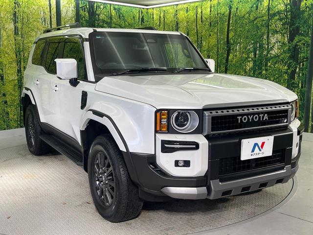 ランドクルーザー２５０ ＶＸ　モデリスタ　ムーンルーフ　純正１２．３型ナビ　ＯＰ１眼ＬＥＤ　７人乗り　全周囲カメラ　黒革　ＢＳＭ　禁煙車　電動リアゲート　ルーフレール　デジタルミラー　シートベンチレーション（18枚目）