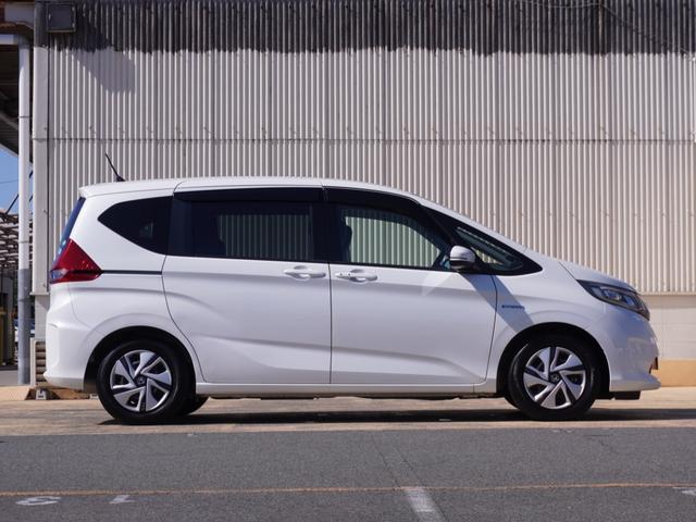 フリードハイブリッド ハイブリッド・Ｇホンダセンシング　ワンオーナー　９インチナビ　バックカメラ　ドラレコ　ＥＴＣ　アダプティブクルーズコントロール　両側電動スライドドア　Ｂｌｕｅｔｏｏｔｈ　フルセグ　ＬＥＤヘッドライト　衝突被害軽減ブレーキ　禁煙車（10枚目）