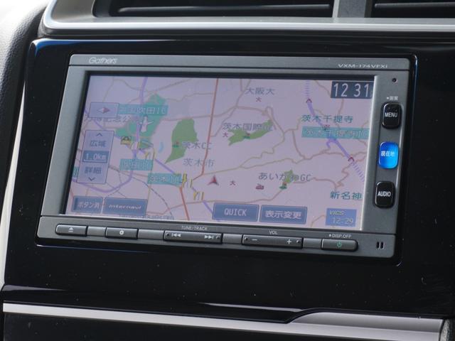 フィット 13G・Fパッケージ ワンオーナー車 純正7インチナビ(VXM-174VFXi) フルセグ リアカメラ ETC チップアップシート アイドリングストップ フロアマット CD DVD Bluetooth SD スマートキー(59枚目)