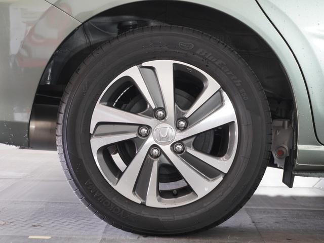 フリード G 2年保証ナビDレコRカメETC両電扉BT地デジ アダプティブクルーズコントロール Bluetooth シートヒーター DVD再生 スペアキー有り 6名乗り3列シート 15インチ純正アルミホイール(18枚目)