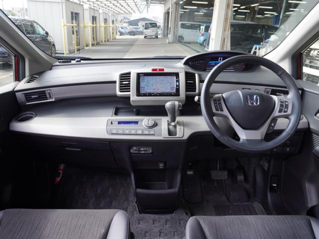 フリードハイブリッド ハイブリッドプレミアムエディション ワンオーナー 7インチナビ バックカメラ ETC クルーズコントロール 両側電動スライドドア Bluetooth ディスチャージドランプ オートエアコン 横滑り防止装置 盗難防止装置 禁煙車(7枚目)