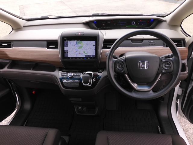 フリードハイブリッド ハイブリッド・Gホンダセンシング 7人乗り 9インチナビ バックカメラ ナビ連動ETC 両側電動スライドドア Bluetooth LEDヘッドライト スマートキー2個 アダプティブクルーズコントロール 禁煙車(7枚目)
