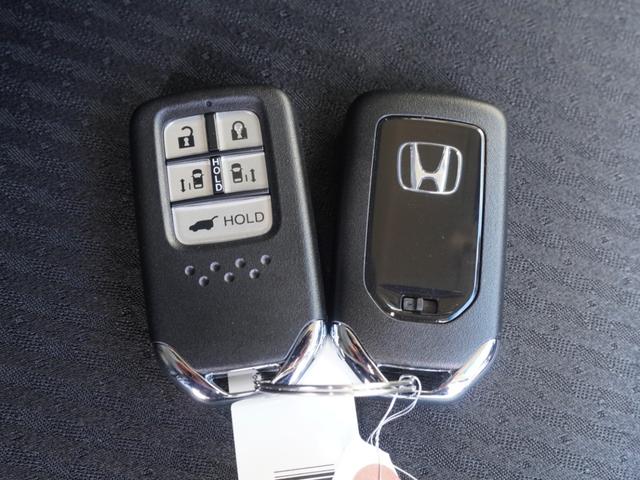 オデッセイハイブリッド ｅ：ＨＥＶアブソルート・ＥＸ　ワンオーナー　１０インチナビ　全周囲カメラ　ドラレコ　ＥＴＣ２．０　アダプティブクルーズコントロール　両側電動スライドドア　シートヒーター　オットマン　ジェスチャーコントロールパワースライドドア（37枚目）