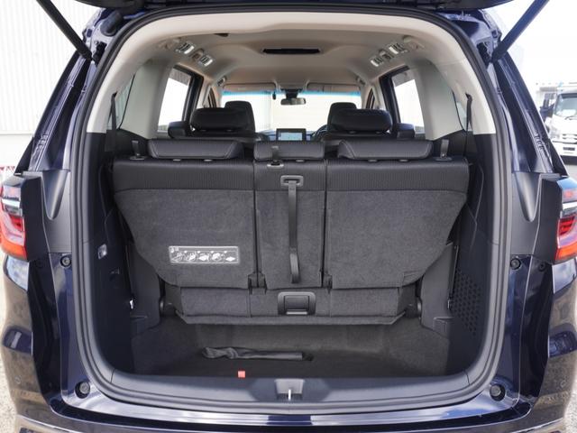 オデッセイハイブリッド ｅ：ＨＥＶアブソルート・ＥＸ　ワンオーナー　１０インチナビ　全周囲カメラ　ドラレコ　ＥＴＣ２．０　アダプティブクルーズコントロール　両側電動スライドドア　シートヒーター　オットマン　ジェスチャーコントロールパワースライドドア（38枚目）