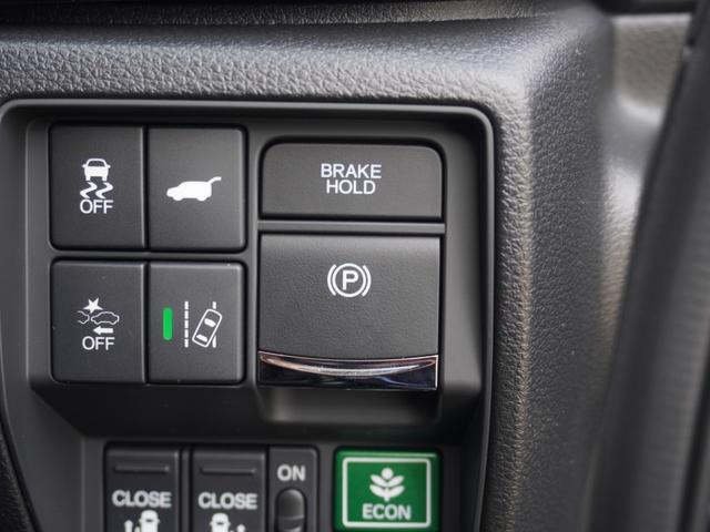 オデッセイハイブリッド ｅ：ＨＥＶアブソルート・ＥＸ　ワンオーナー　１０インチナビ　全周囲カメラ　ドラレコ　ＥＴＣ２．０　アダプティブクルーズコントロール　両側電動スライドドア　シートヒーター　オットマン　ジェスチャーコントロールパワースライドドア（49枚目）