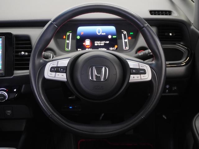 フィット e:HEVホーム20周年特別仕様車カーサ 2年保証ナビDレコRカメETCクルコンBT地デジ 渋滞追従クルーズ 障害物センサー シートヒーター オートハイビーム Bluetooth フルセグTV 16インチ純正アルミホイール(9枚目)