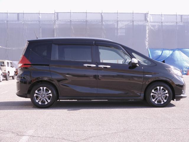 フリードハイブリッド ハイブリッド・クロスターホンダセンシング 9インチナビ Bluetooth Rカメラ 音楽録音 LEDオートライト 両側パワースライドドア 前後ドラレコ スマートキー2個 本革ステアリング 衝突軽減ブレーキ レーンキープ ワンオーナー(28枚目)