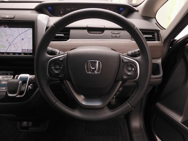 フリードハイブリッド ハイブリッド・クロスターホンダセンシング 9インチナビ Bluetooth Rカメラ 音楽録音 LEDオートライト 両側パワースライドドア 前後ドラレコ スマートキー2個 本革ステアリング 衝突軽減ブレーキ レーンキープ ワンオーナー(52枚目)