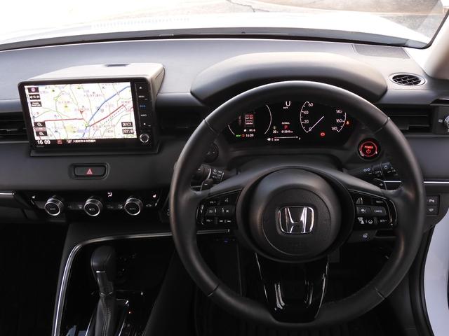 ヴェゼル ｅ：ＨＥＶＺ　ワンオーナー　９インチナビ　バックカメラ　ドラレコ　ＥＴＣ　渋滞追従クルーズ　Ｂｌｕｅｔｏｏｔｈ　障害物センサー　シートヒーター　ダウンヒルアシスト　ハンドルヒーター　本革巻ハンドル　オートハイビーム（9枚目）