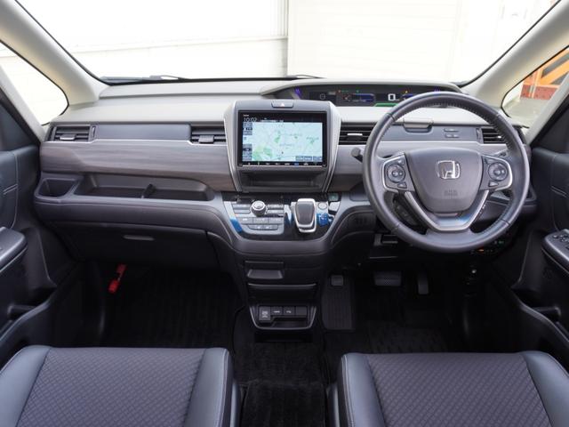 フリードハイブリッド ハイブリッド・Ｇホンダセンシング　ワンオーナー　９インチナビ　後席モニター　バックカメラ　ＥＴＣ　アダプティブクルーズコントロール　両側電動スライドドア　シートヒーター　Ｂｌｕｅｔｏｏｔｈ　ＬＥＤヘッドライト　禁煙車　スペアキー有り（8枚目）