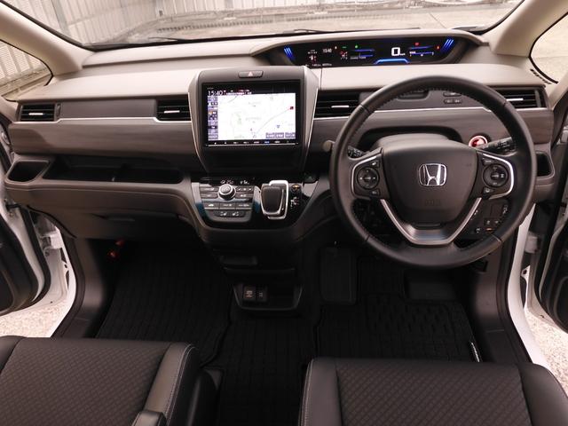 フリード＋ハイブリッド ハイブリッドＧ・ホンダセンシング　ワンオーナー　いまコレ＋新品マット付き　９インチナビ　バックカメラ　ドラレコ　ＥＴＣ　アダプティブクルーズコントロール　両側電動スライドドア　シートヒーター　ＬＥＤヘッドライト　フルセグＴＶ　禁煙車（9枚目）