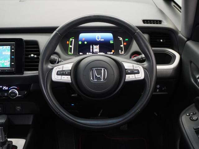 フィット ｅ：ＨＥＶホーム　１年保証ナビＤレコＲカメＥＴＣクルコンＢＴ地デジ　渋滞追従クルーズ　Ｂｌｕｅｔｏｏｔｈ　障害物センサー　デイライト　オートハイビーム　ＵＳＢ接続　衝突軽減ブレーキ　オートブレーキホールド　オートライト（9枚目）