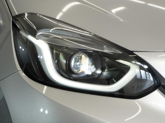 フィット ｅ：ＨＥＶベーシック　２年保証ナビＤレコＲカメＥＴＣクルコンＢＴ　渋滞追従クルーズ　Ｂｌｕｅｔｏｏｔｈ　障害物センサー　オートライト　デイライト　禁煙車　ＤＶＤ再生　衝突軽減ブレーキ　スペアキー有　ＬＥＤヘッドライト（13枚目）