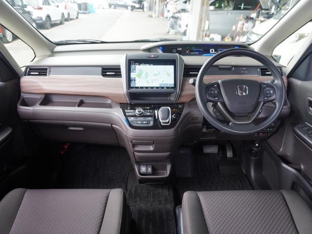 フリードハイブリッド ハイブリッド・Ｇホンダセンシング　９インチナビ　バックカメラ　ドラレコ　ＥＴＣ　アダプティブクルーズコントロール　両側電動スライドドア　シートヒーター　Ｂｌｕｅｔｏｏｔｈ　ＬＥＤヘッドライト　衝突被害軽減ブレーキ　フルセグ　禁煙車（9枚目）