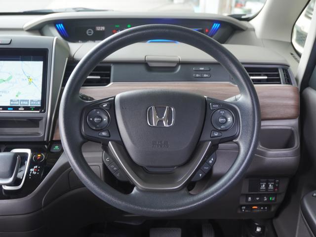 フリードハイブリッド ハイブリッド・Ｇホンダセンシング　９インチナビ　バックカメラ　ドラレコ　ＥＴＣ　アダプティブクルーズコントロール　両側電動スライドドア　シートヒーター　Ｂｌｕｅｔｏｏｔｈ　ＬＥＤヘッドライト　衝突被害軽減ブレーキ　フルセグ　禁煙車（10枚目）