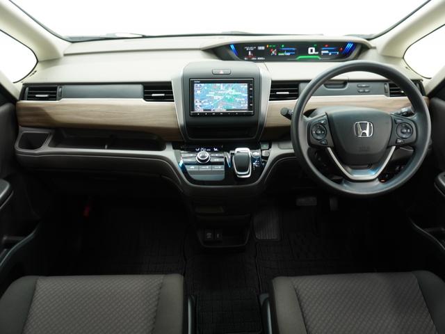 フリードハイブリッド ハイブリッド・Ｇホンダセンシング　ワンオーナー　７インチ純正ナビ　ＥＴＣ　バックカメラ　両側電動スライドドア　アダプティブクルーズコントロール　Ｂｌｕｅｔｏｏｔｈ　ＵＳＢ接続　ＬＥＤヘッドライト　７人乗り　前後ドライブレコーダー（3枚目）