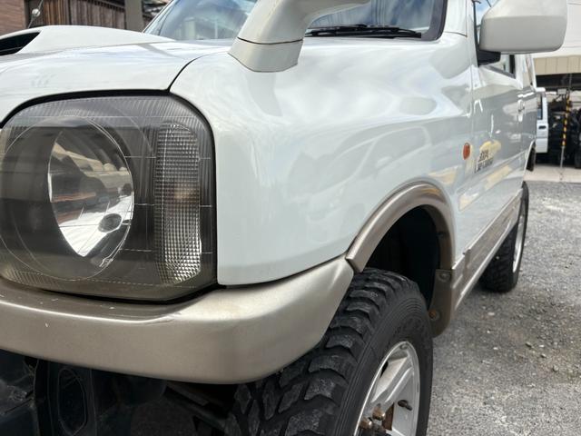 ジムニー ランドベンチャー 前席パワーウインドウ リフトアップ車 助手席エアバック 運転席エアバッグ 革シート 4WD車 キーレス付 PS 衝突安全ボディ ABS付 シートヒータ ETC ATエアコン(23枚目)