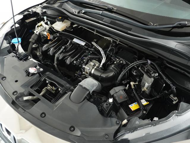 ヴェゼル ハイブリッドＺ・ホンダセンシング　ナビ　Ｒカメ　ＥＴＣ　クルコン　ＢＴ　地デジ　シートヒーター　ブレーキホールド付電動パーキングブレーキ　インテリア内装ブラック　運転席ハイトアジャスターシート　サイドバイザー　合皮コンビシート（18枚目）