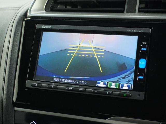 フィットハイブリッド Lパッケージ ナビ 地デジ DVD CD リアカメラ ETC インテリア内装ブラック 運転席ハイトアジャスターシート フロントグラデーションガラス アームレスト 合皮コンビシート 社外アルミホイル オートエアコン.(3枚目)