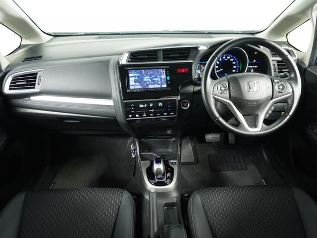 フィットハイブリッド Lパッケージ ナビ 地デジ DVD CD リアカメラ ETC インテリア内装ブラック 運転席ハイトアジャスターシート フロントグラデーションガラス アームレスト 合皮コンビシート 社外アルミホイル オートエアコン.(6枚目)