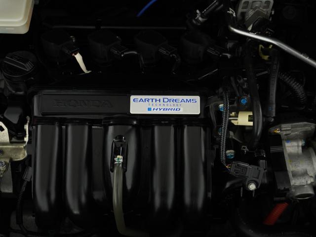 フィットハイブリッド Lパッケージ ナビ 地デジ DVD CD リアカメラ ETC インテリア内装ブラック 運転席ハイトアジャスターシート フロントグラデーションガラス アームレスト 合皮コンビシート 社外アルミホイル オートエアコン.(23枚目)