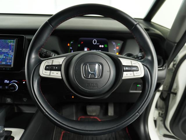 フィット e:HEVホーム20周年特別仕様車カーサ 1オ-ナ ナビ Rカメ Dレコ前後 ETC2.0 運転席ハイトアジャスターシート シートヒーター 合皮コンビシート サイドバイザー ウインカーミラー ブレーキホールド付電動パーキングブレーキ(9枚目)