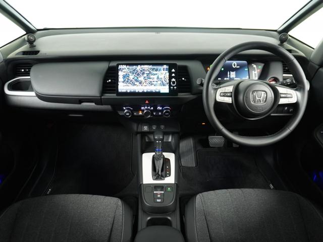 フィット e:HEVホーム 1オ-ナ- ナビ Rカメ ETC2.0 地デジ BT接続 LED 運転席ハイトアジャスターシート インテリア内装ブラック ブレーキホールド付電動パーキングブレーキ 合皮コンビシート オートエアコン.(7枚目)