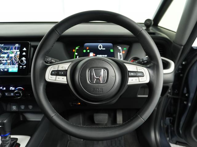 フィット e:HEVホーム 1オ-ナ- ナビ Rカメ ETC2.0 地デジ BT接続 LED 運転席ハイトアジャスターシート インテリア内装ブラック ブレーキホールド付電動パーキングブレーキ 合皮コンビシート オートエアコン.(8枚目)